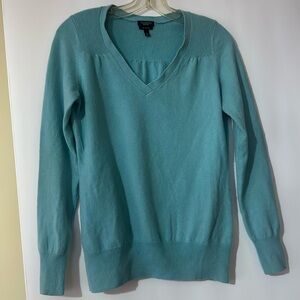 Soft, spring cashmere in aqua with flattering tucking and deep v neck.